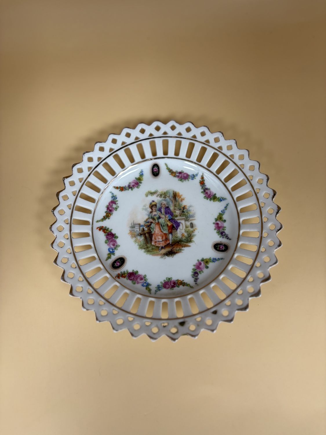 Porcelain. Germany. Schumann Bavaria. Plate. Scene of Victorian Couple with Floral Decorations. Reticulated with Gold Edge. 5.5&quot; Diameter.