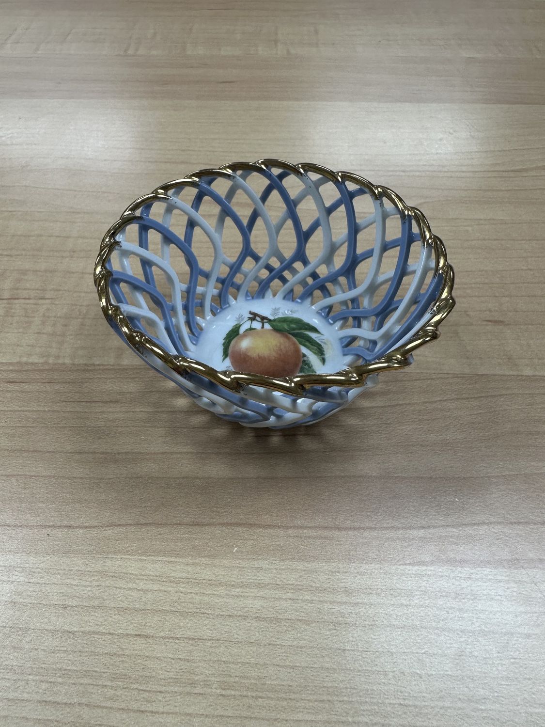 Porcelain. Romania. Cluj Napoca. Basket. Blue &amp; White Lattice w/Gold Rim. Image of Peach in Center. 3.5&quot;W