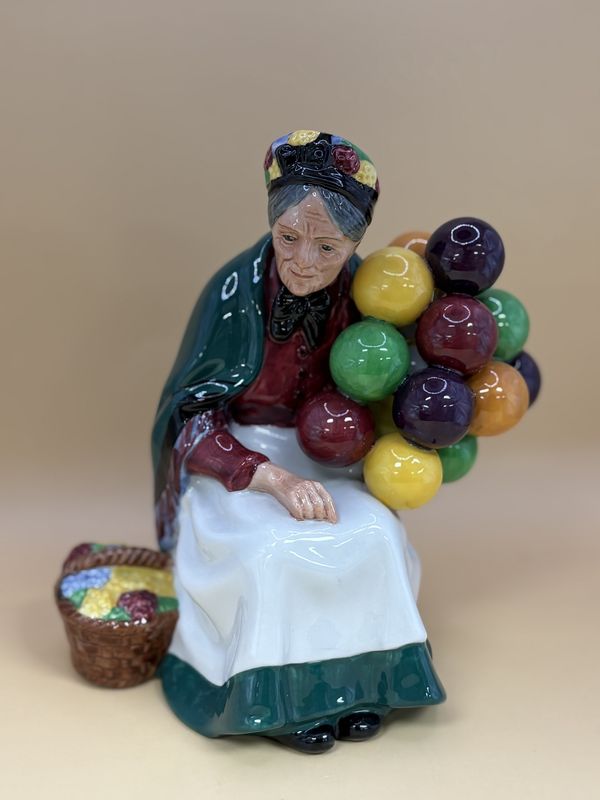 Ceramic. England.  Royal Doulton.  Old Balloon Seller. Female.  8&quot;H