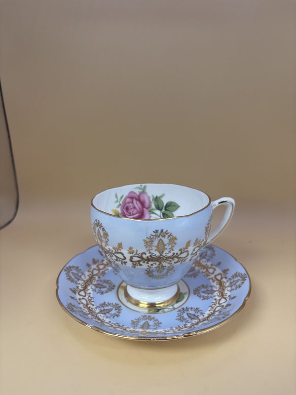 Porcelain. England.  Royal Grafton. Teacup w/Saucer. Light Blue &amp; Gold w/Pink Rose