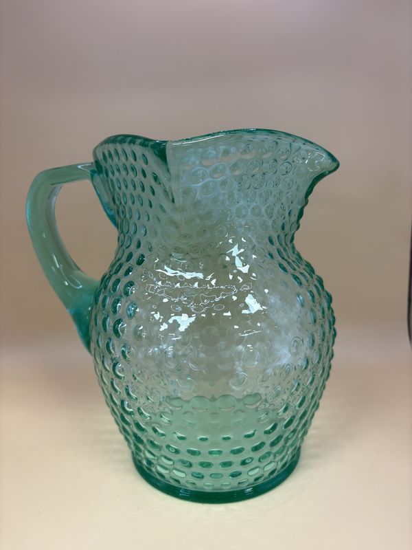 Glass. USA. Fenton. Pitcher. Green Opalescence Hobnail.  7&quot;H.