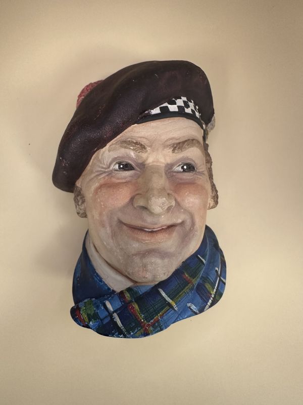 Chalkware. England. Legend Wall Ornament. &quot;Jock&quot; with Checkboard Trim Cap. 6.00&quot;H