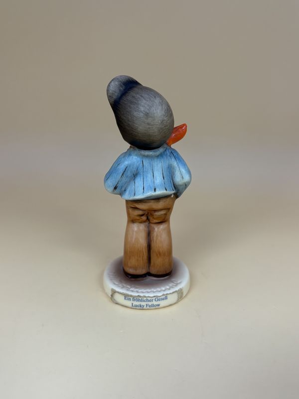 Figurine. German. Hummel. #560 "Lucky Fellow". TMK 7 (1991-2000). 3.5"H