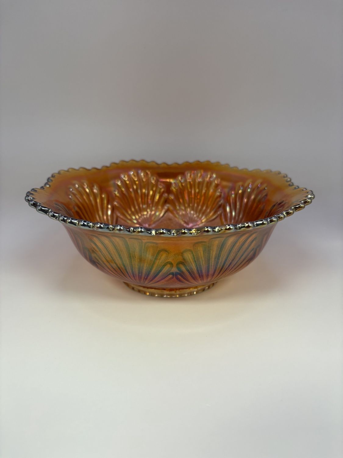 Glass. USA. Imperial Carnival Glass. Bowl with &quot;Sand and Shell&quot; Pattern. Marigold. 7.5&quot;W