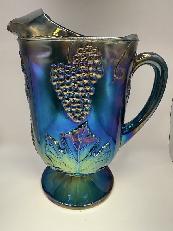 Glass. USA. Indiana Carnival Glass. Footed Pitcher. &quot;Harvest Grape&quot; Pattern. Blue. 10.5&quot;H