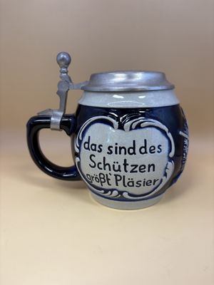 Stein. West Germany. Stein with Lid. "The target, the woman, &amp; a pint of beer are the marksman's greatest pleasure". Blue &amp; Gray. 1992. 5.75"H