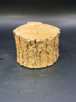 Sculpted Figure. USA. Tom Clark. Cairn Studio. Riser 3. Tree stump with gnome face (red hat) and leaves on the side. 1985. 2"H