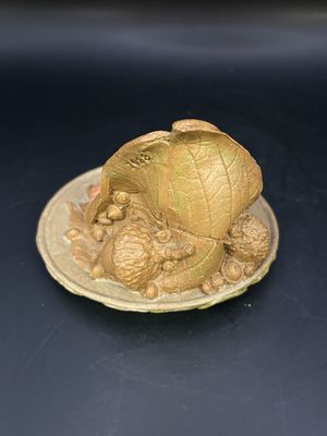 Sculpted Figure. USA. Tom Clark. Colette. Woman in Yellow Top &amp; Red Skirt Lying under a Leaf. 1984. 2.5"H