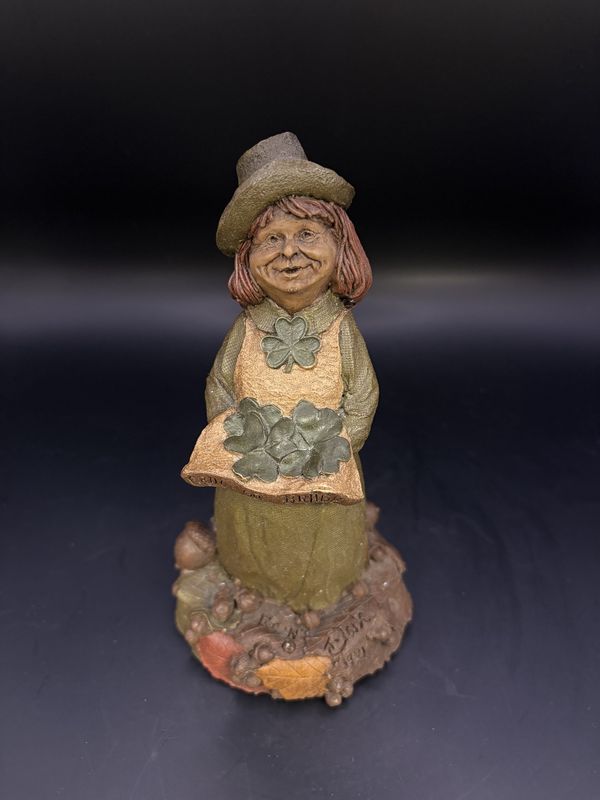 Sculpted Figure. USA. Tom Clark. Erin Go Bragh. Female Irish Leprechaun Holding Clovers in Her Apron. 1991. 6&quot;H