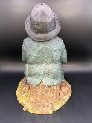 Sculpted Figure. USA. Tom Clark. Signed. Lawrence. Man of Color Seated on a Basket Amid Peanut Hulls, Corn, &amp; Black-eyed Peas. 1981. 8.5"H