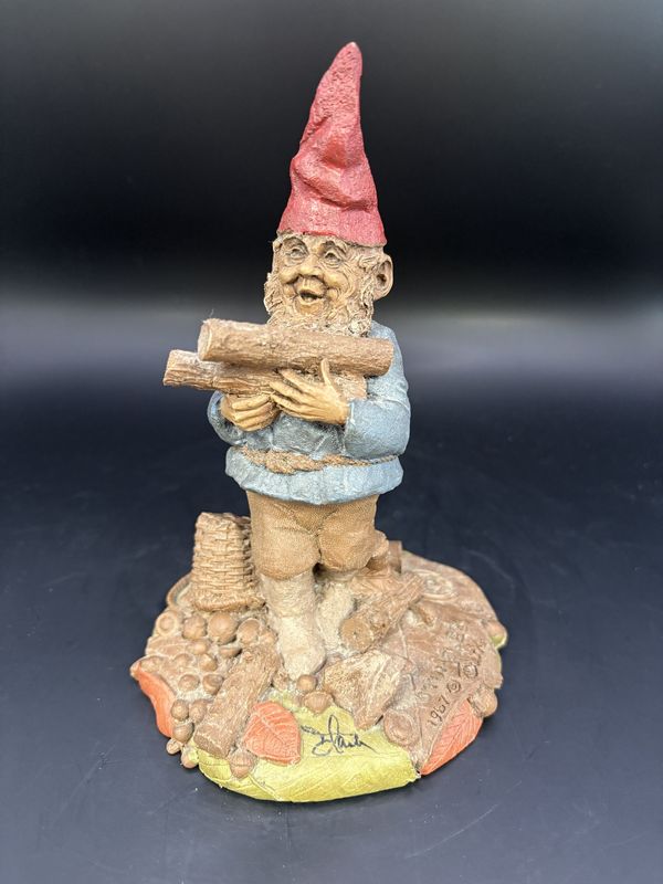 Sculpted Figure. USA. Tom Clark. Signed. Stumbles. Gnome Carrying Logs, Tripping over Log. 1987. 6.25&quot;H