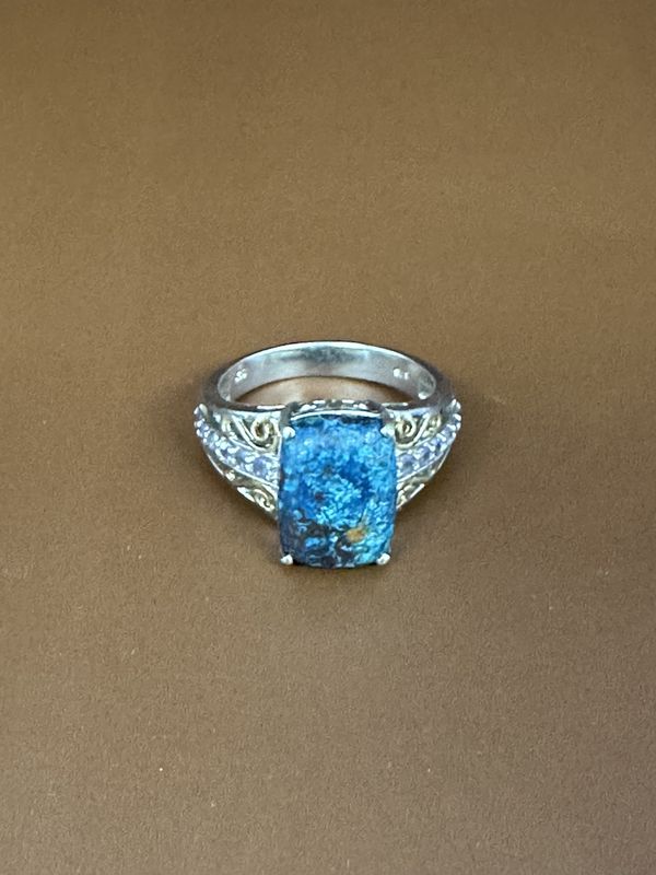 Jewelry. Ring. Sterling Silver Band w/Cushion Cut Chrysocolla Stone, Flanked by 12 Petite Tanzanites in a Filigree Setting. Size 9.5