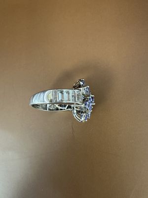 Jewelry. Ring. Sterling Silver Band w/3 Carats of Tanzanite Flower, w/Side Baguettes (White Topaz?). Size 10