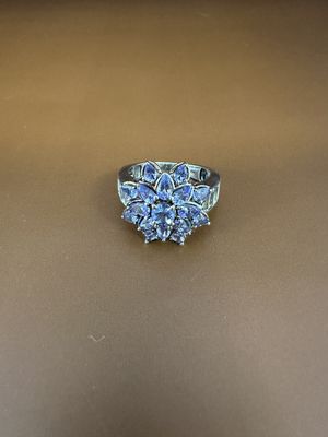 Jewelry. Ring. Sterling Silver Band w/3 Carats of Tanzanite Flower, w/Side Baguettes (White Topaz?). Size 10