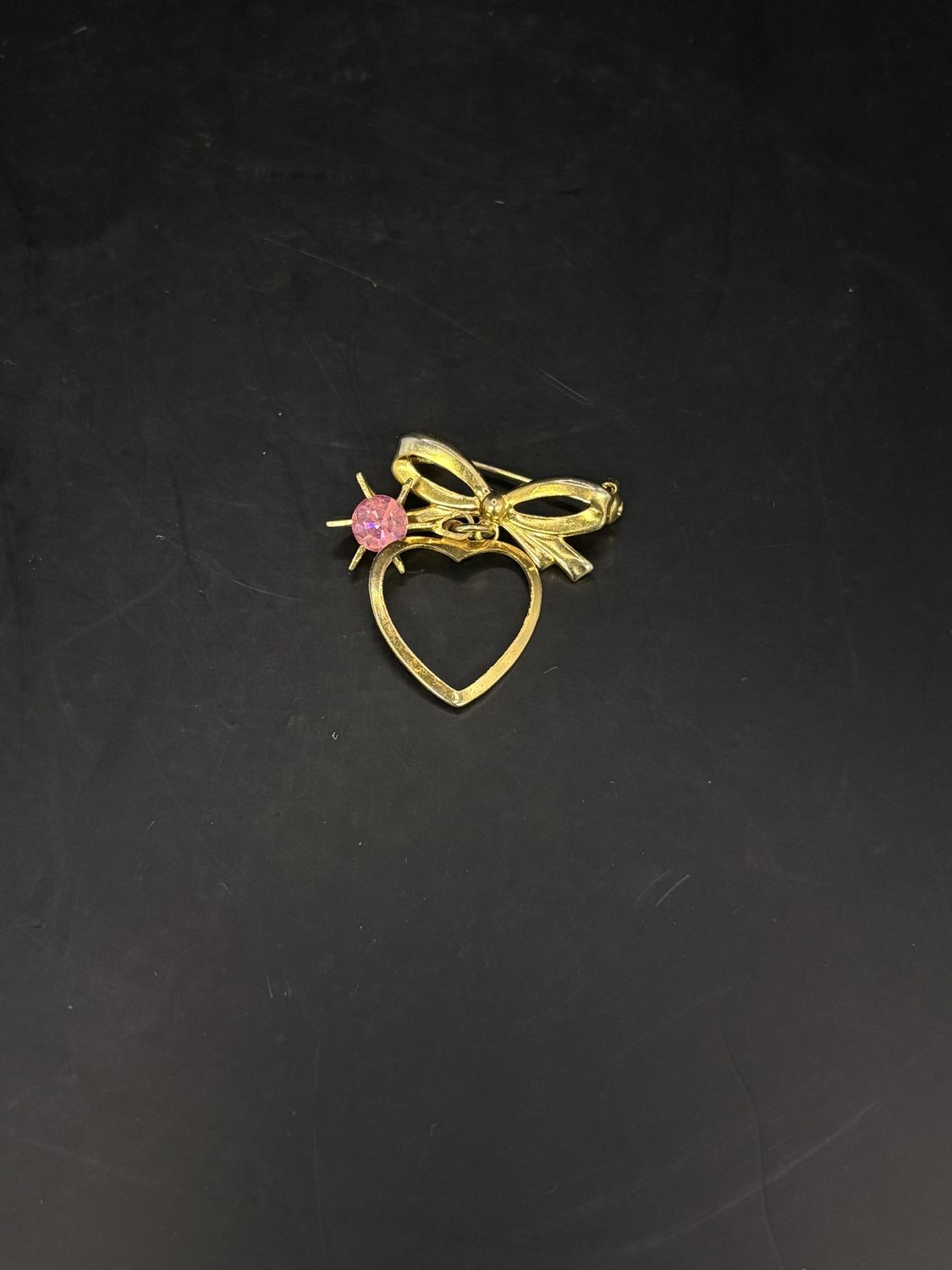 Jewelry. Pin. Gold Heart and Ribbon w/ Pink Rhinestone Hanging in Center. 1.25&quot;h