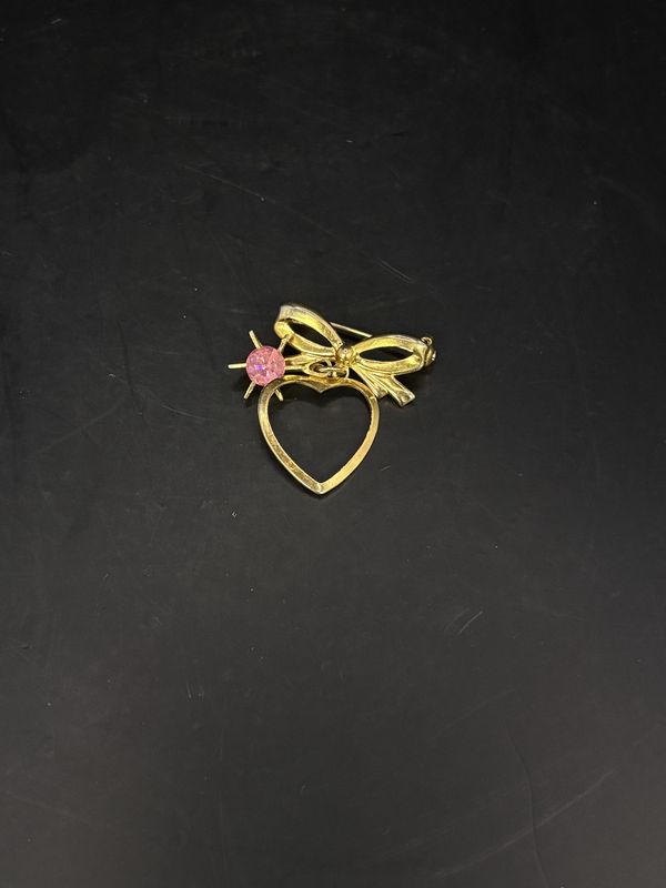 Jewelry. Pin. Gold Heart and Ribbon w/ Pink Rhinestone Hanging in Center. 1.25&quot;h