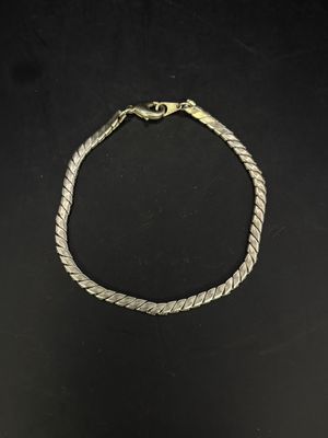 Jewelry. Bracelet. Silver Toned Twisted Shape Charm.  3.5"L