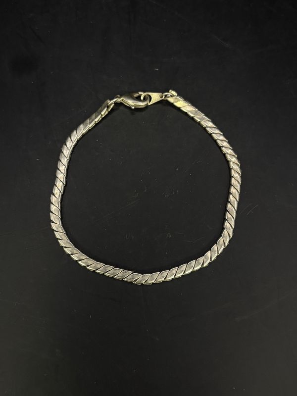 Jewelry. Bracelet. Silver Toned Twisted Shape Charm.  3.5&quot;L