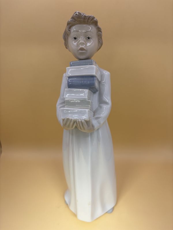 Figurine. Spain. Lladro NAO. #23 LN 2082 &quot;Boy with Books&quot;. 11.25&quot;H