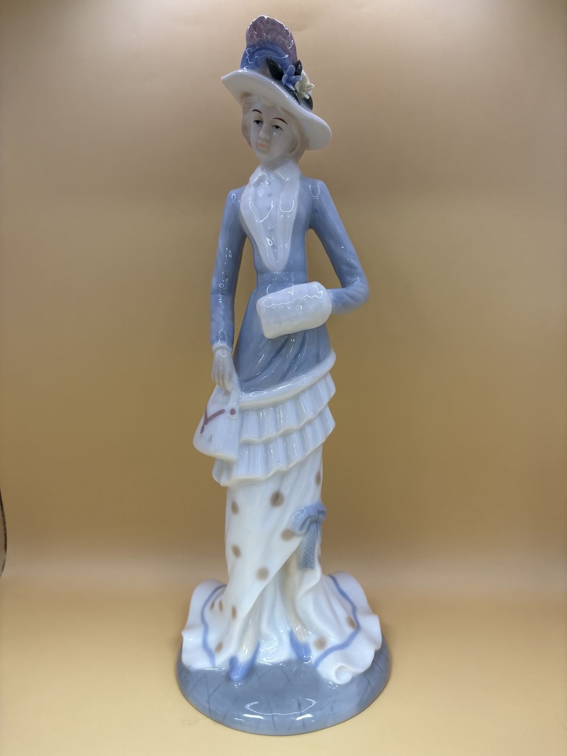 Figurine. Spain. Lladro. Woman Wearing Blue. Flower Hat and White Purse.