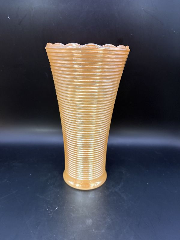 Glass. Carnival Glass. Tall Ribbed Vase with Scalloped Top Edge. Peach Color With a Pearl Luster Finish. 7.25