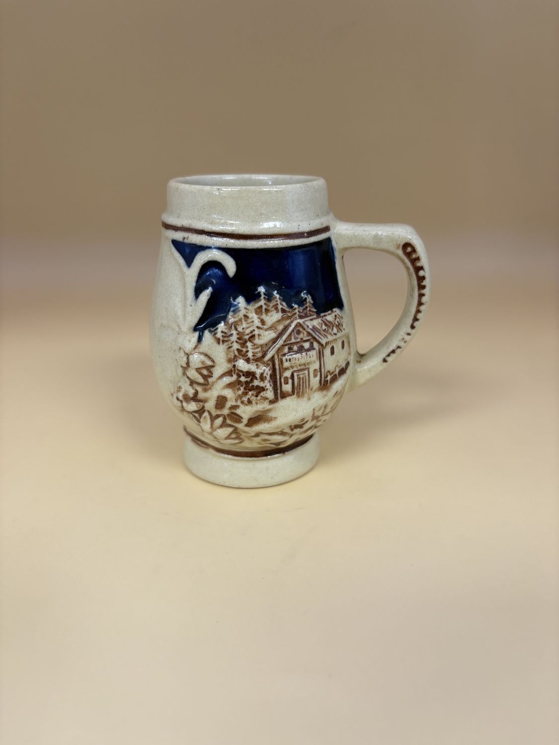 Stein. Cream and Dark Blue. Floral and House Decals on Sides. 3.5&quot;H