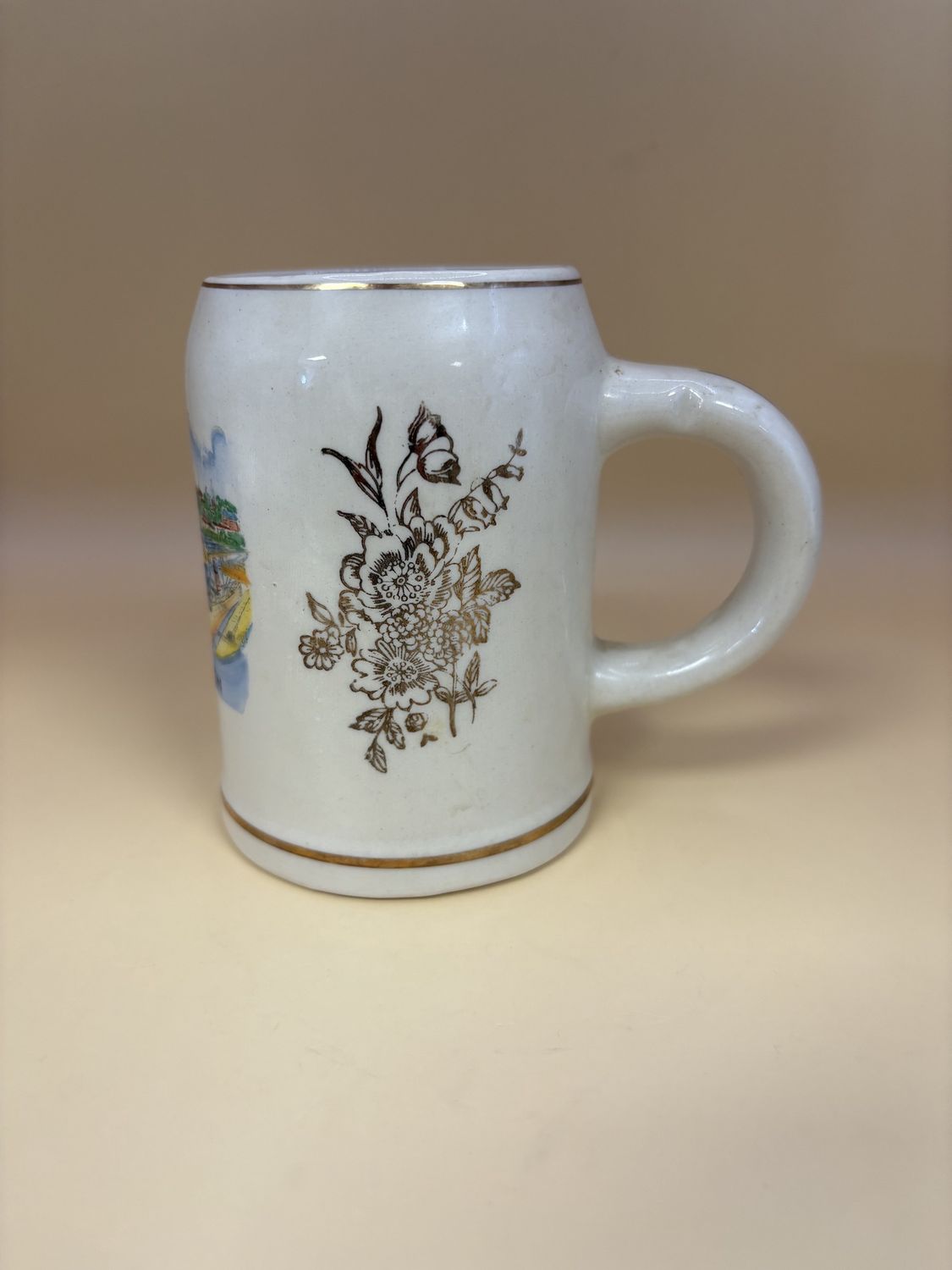 Mug. Germany. Bremerhaven City Painted on Cream Mug w/ Gold Floral Decal on Sides. 4.25&quot;H