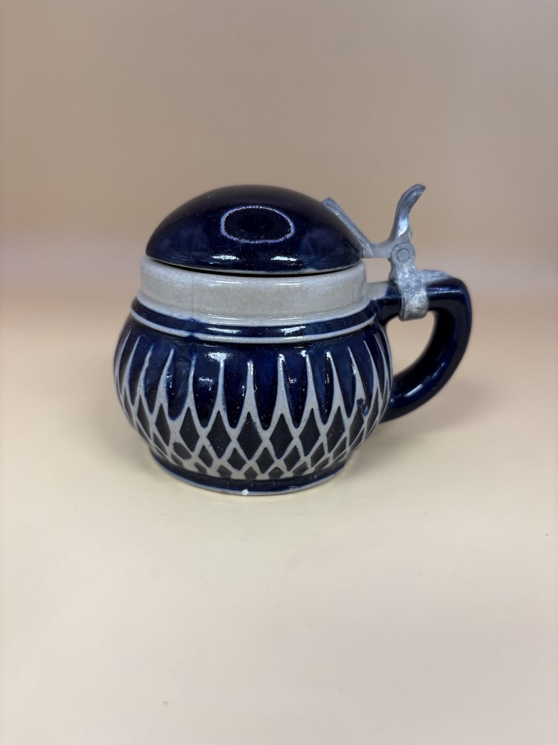 Stein. Germany. Dark Blue Stein Pot w/ Grey Crossed Lines on Bottom. 3&quot;H