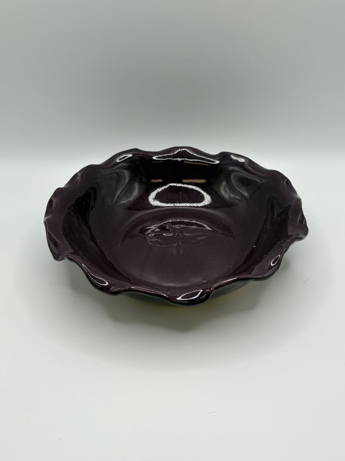 Pottery. Purple Bowl w/Ruffled Edge and Dragon Fly in the Middle. 7.75&quot;W