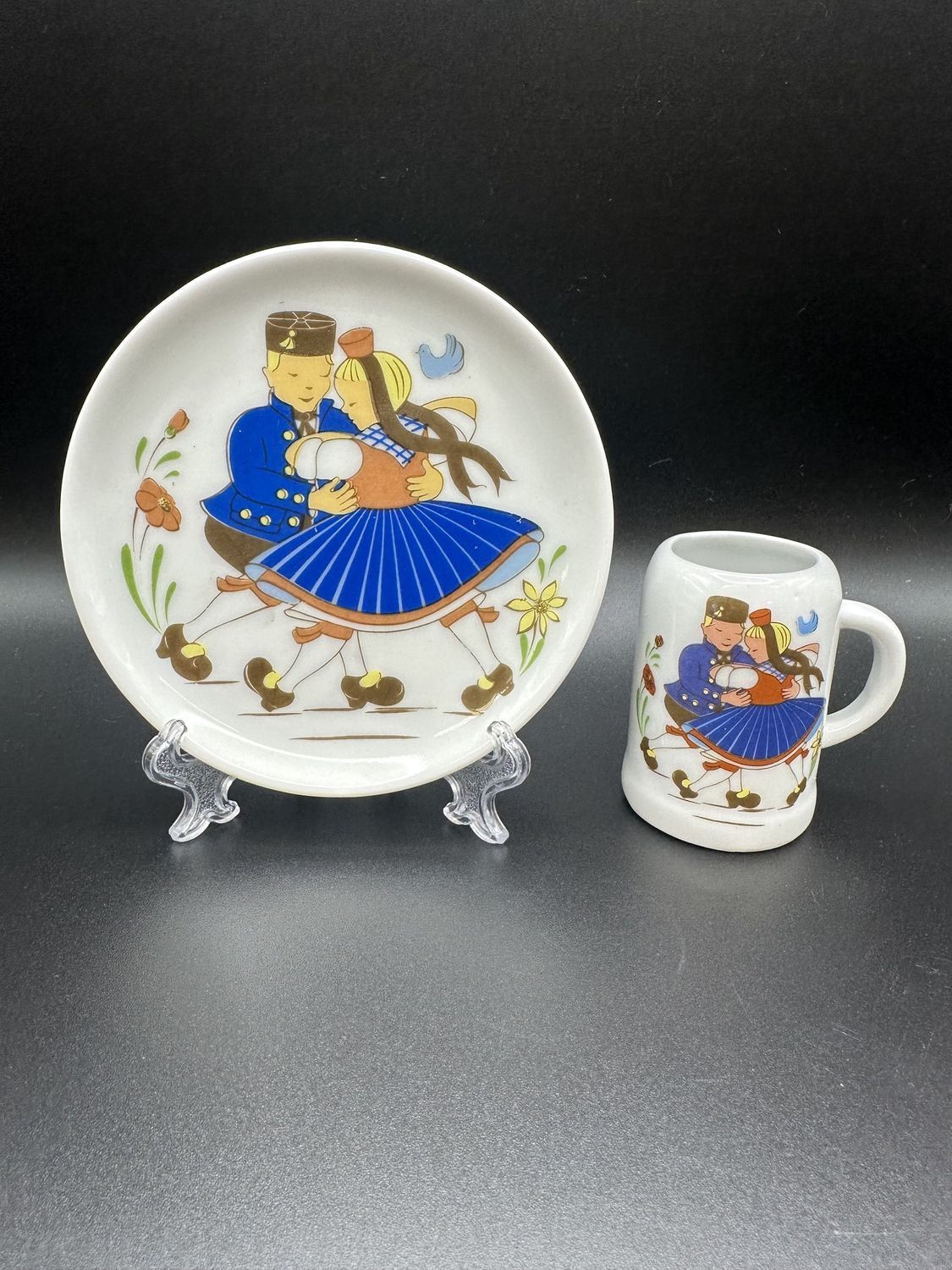 Porcelain. Dürer-Haus Marburg. Souvenir Plate (4&quot;W) &amp; Miniature Mug (2&quot;H). White Porcelain w/Blonde Folk Dancing Couple (Set of 2 Items)