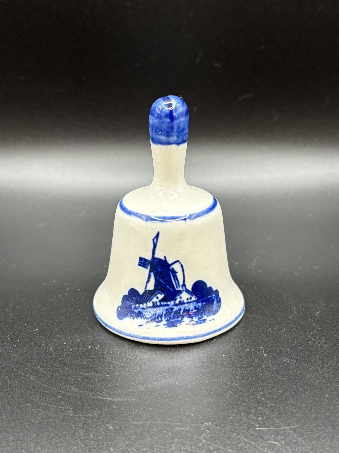 Ceramic. Netherlands. Delft. White &amp; Blue Small Bell w/Windmill Design on Front. 3&quot;H