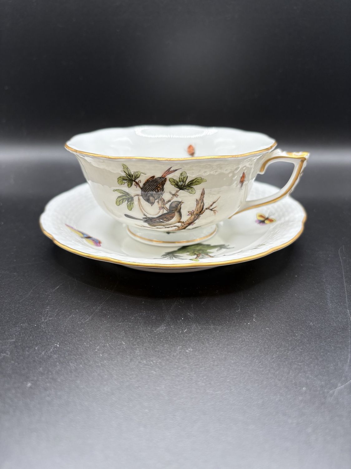 Porcelain. Hungary. Herend. Footed Teacup and Saucer. 24K Gold Trim. Rothschild Bird Design.