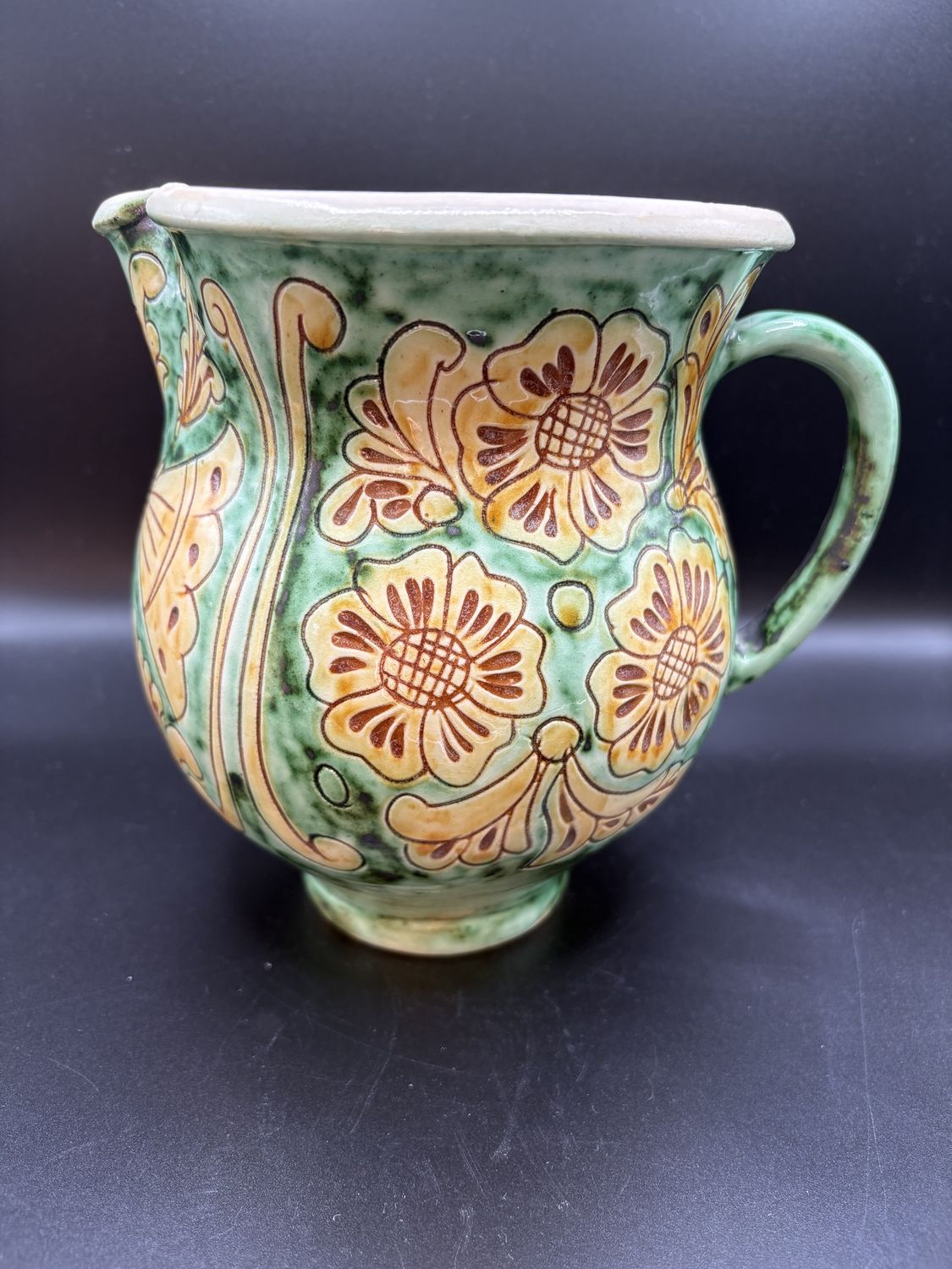 Ceramic. Molnos Jozsef. Greece. Handpainted Green Pitcher w/ Yellow Floral Design. 6.75&quot;H
