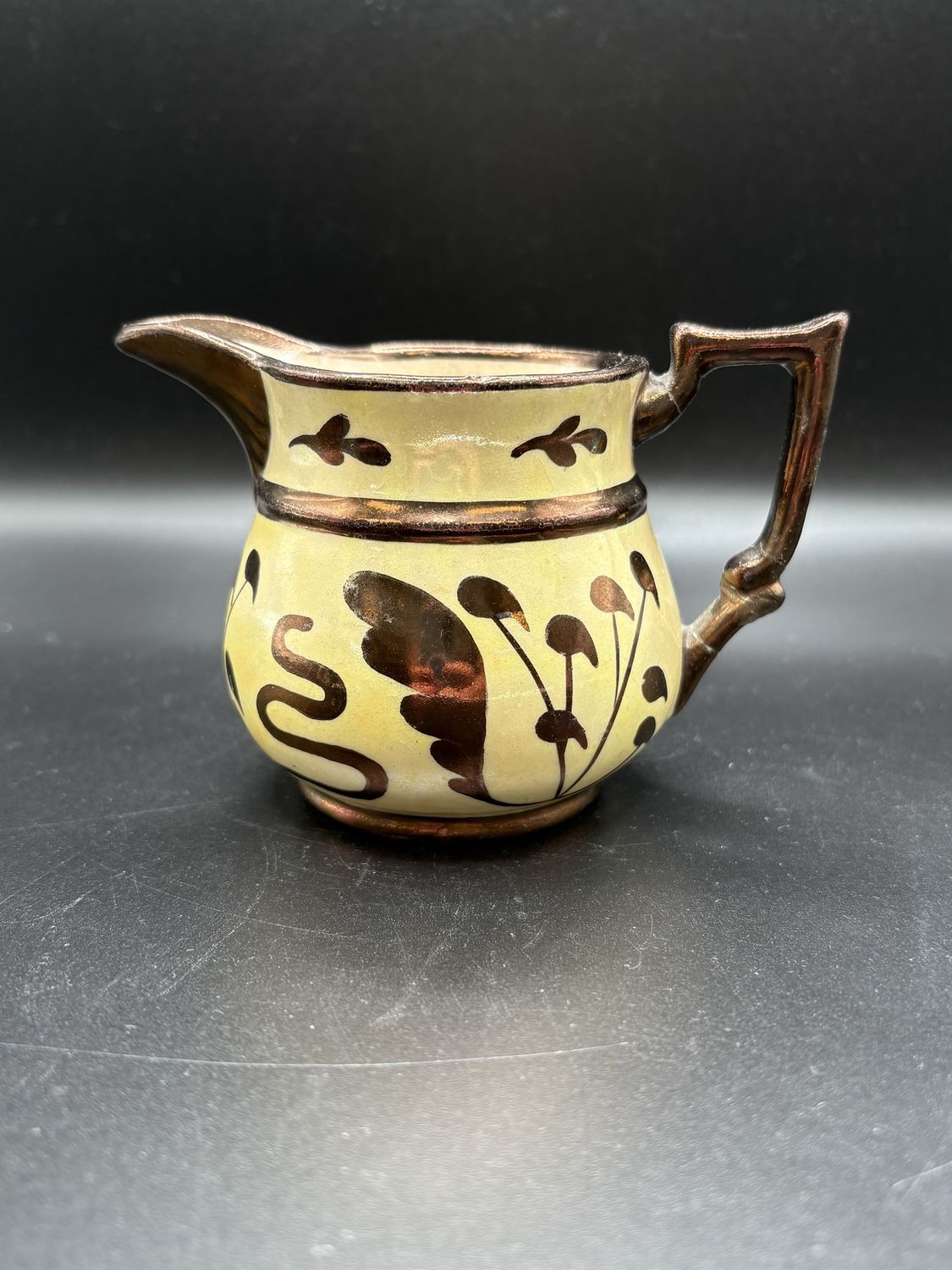 Dishware. England. Copper Lusterware Pitcher Painted White w/ Brown Floral Pattern. 3&quot;H