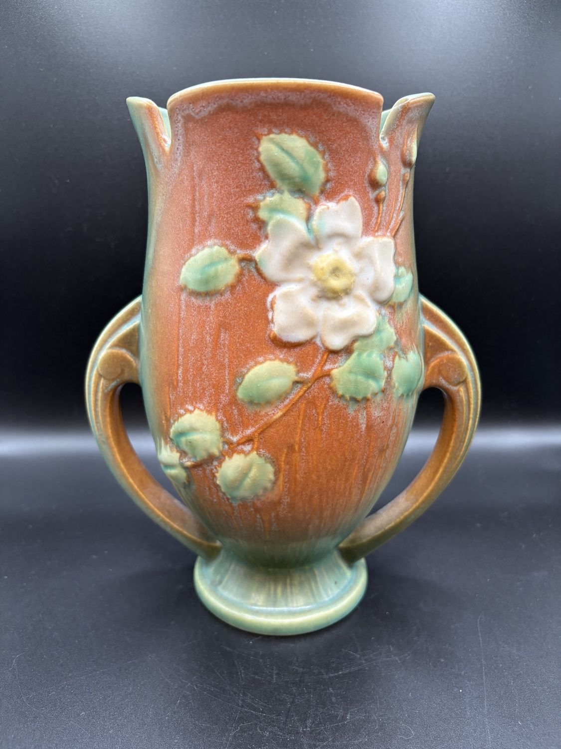 Vase. USA. Roseville Pottery. 986-9. White Rose Pattern on Orange and Teal. 9.5&quot;H
