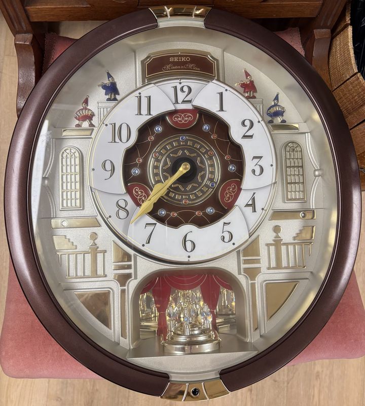 Clock. Seiko. Melodies in Motion Animated Musical Wall Clock w/Rotating Dial. Plays 24 Songs