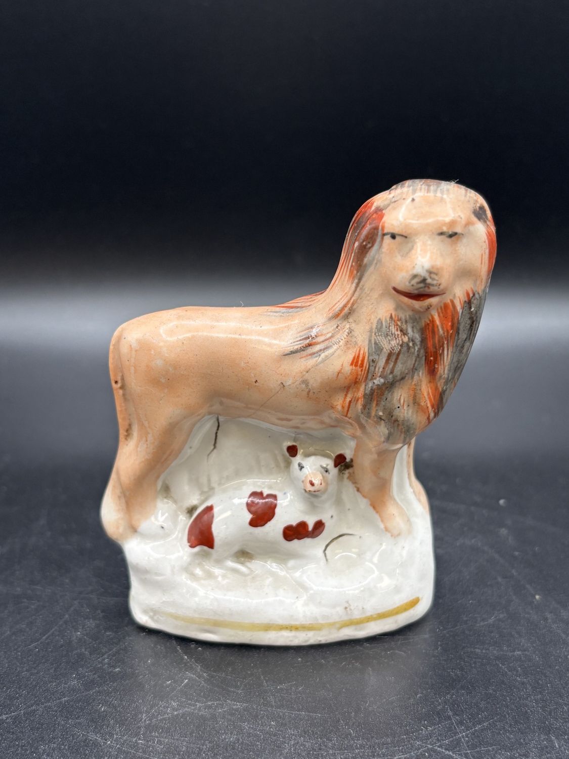 Figurine. England. Staffordshire Pottery. Lion with Lamb. 3&quot;L
