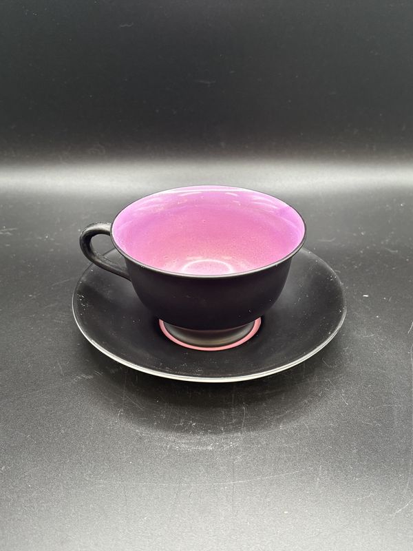 Porcelain. England. Collingwood. Teacup with Saucer. Black with Purple/Pink Interior. Teacup is 2.25&quot;H