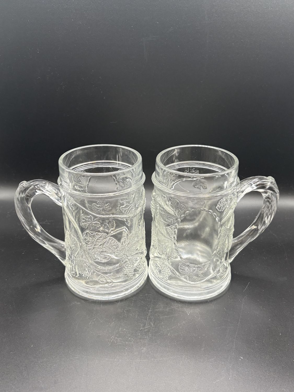 Stein. Clear Glass Mugs w/ Grapevine Pattern. Set of 2. 5&quot;H
