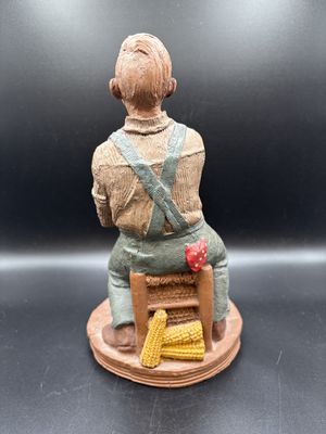 Sculpted Figure. USA. Tom Clark. #1145 "Jacob." Man Sitting in Chair above Sack of Corn. 1986. Signed. 9"H