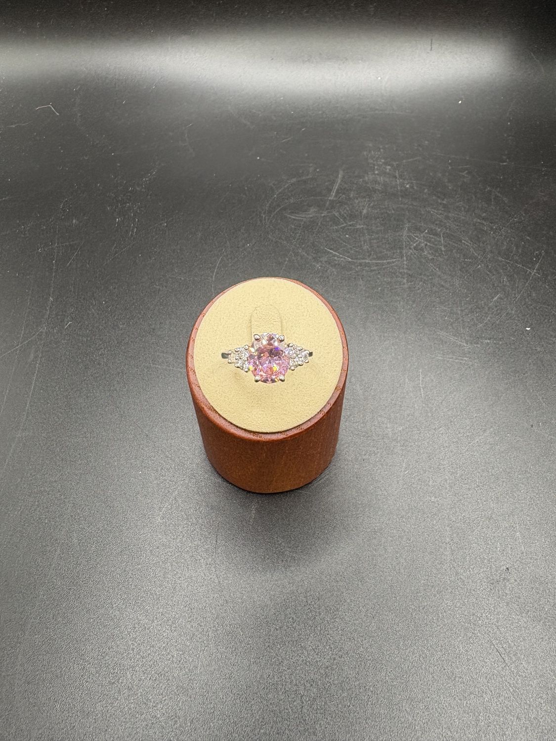 Jewelry. Ring. Rhodium Plated Ring w/Pink Gemstone and Clear Accent Stones. Size 9