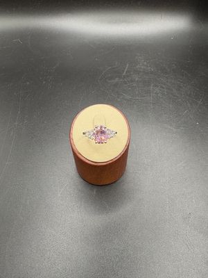 Jewelry. Ring. Rhodium Plated Ring w/Pink Gemstone and Clear Accent Stones. Size 9