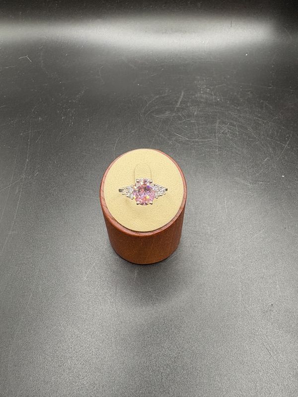 Jewelry. Ring. Rhodium Plated Ring w/Pink Gemstone and Clear Accent Stones. Size 9