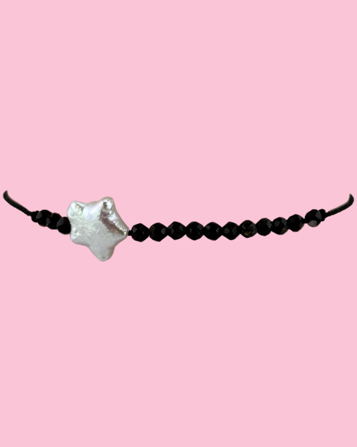 pearl and black stones