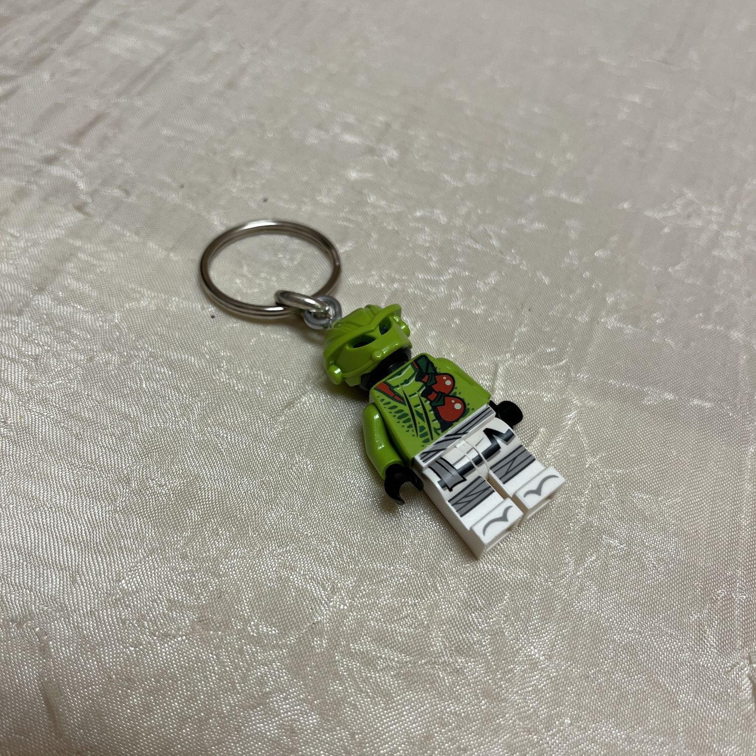 green alien lego keychain