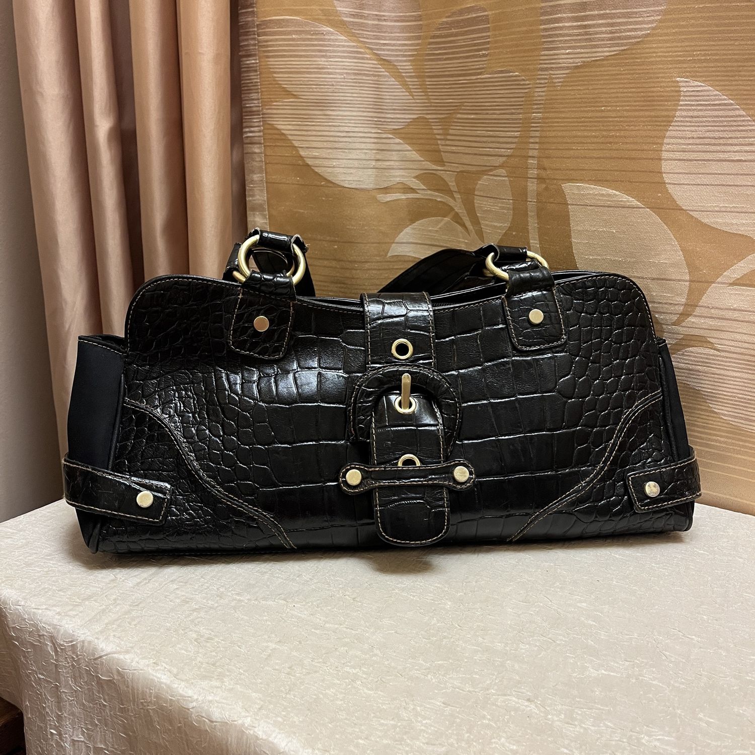 long black textured leather bag