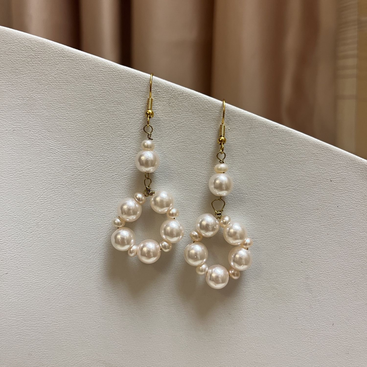 pink pearl O earrings