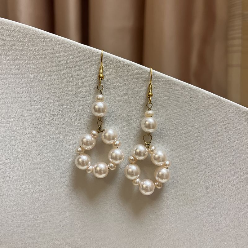 pink pearl O earrings