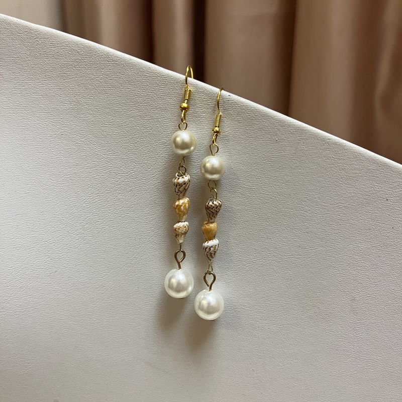 three shell pearl earrings