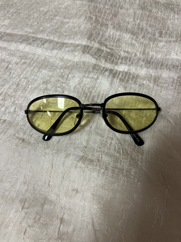 yellow black rimmed sunglasses